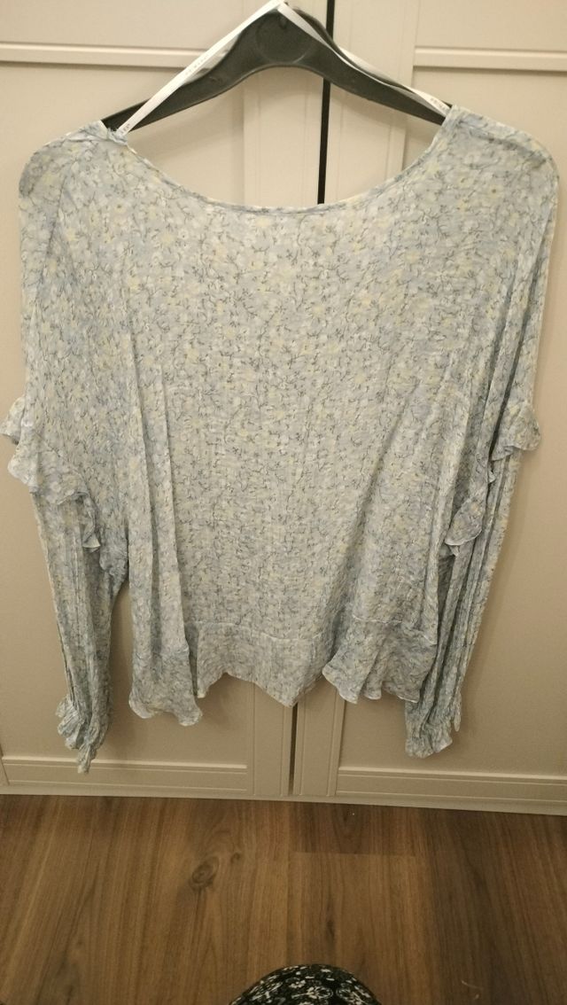 Blusa azzurra maniche lunghe