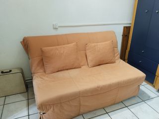 Sofá cama naranja plegable