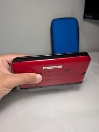 Nintendo 3DS XL rossa/nera + accessori 