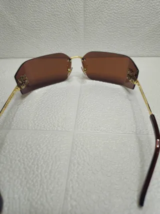 Occhiali da sole Miu Miu - Marroni e Oro