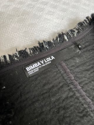Chaqueta tweed blanco y negro