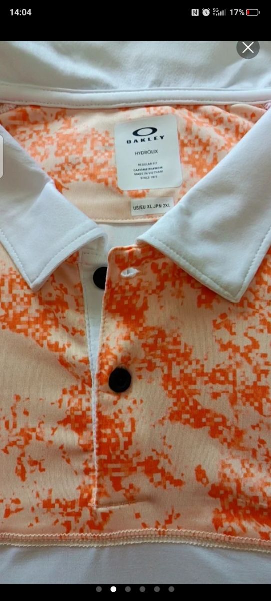 Polo Oakley naranja y blanco