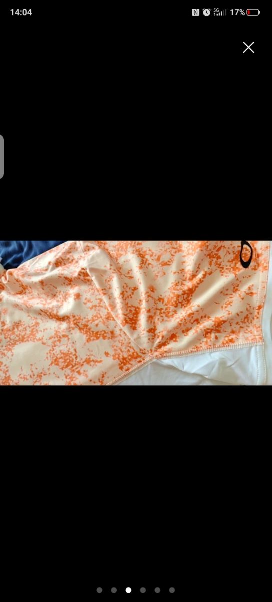 Polo Oakley naranja y blanco