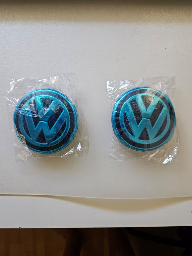 2 Tapabujes VW emblemas