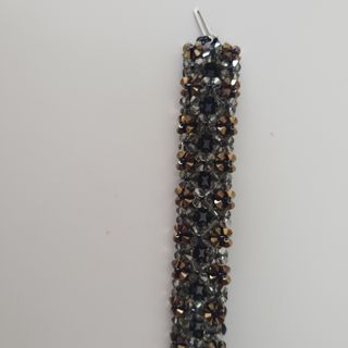 Pulsera Swarovski negra y dorada