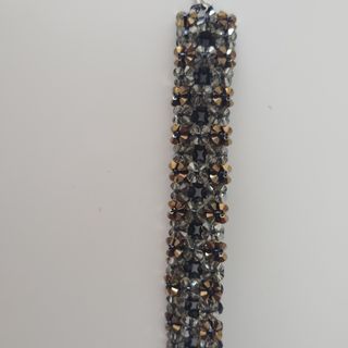 Pulsera Swarovski negra y dorada