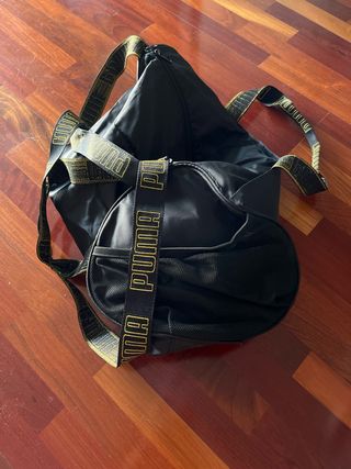 Mochila Puma Negra y Dorada