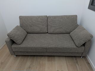 Sofá cama gris de alta gama con otomana