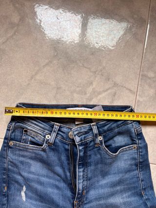 Jeans skinny strappati blu