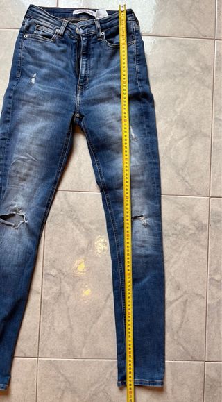 Jeans skinny strappati blu