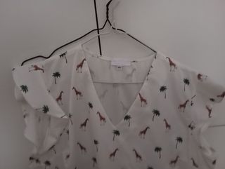 Blusa blanca estampado jirafas - XL
Falda verde