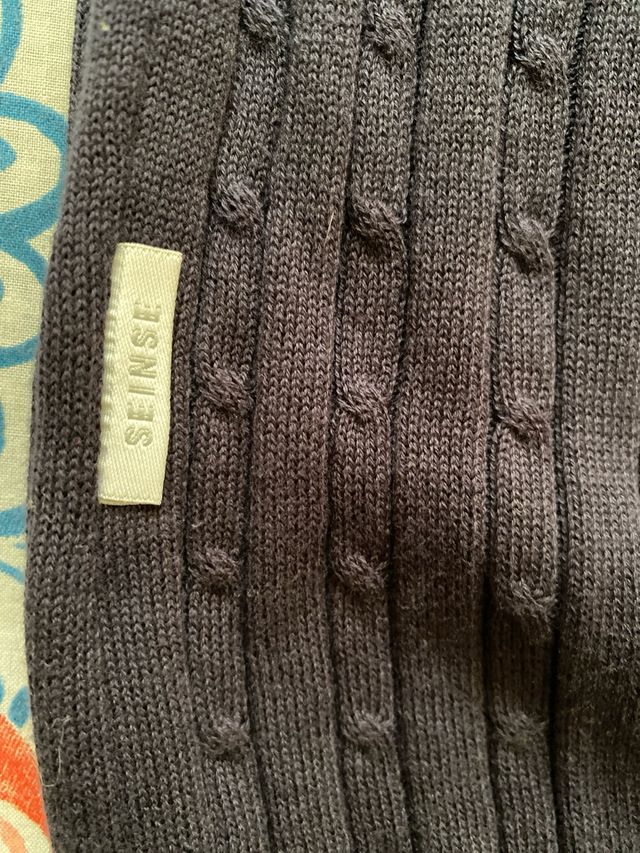 Polo de punto azul marino