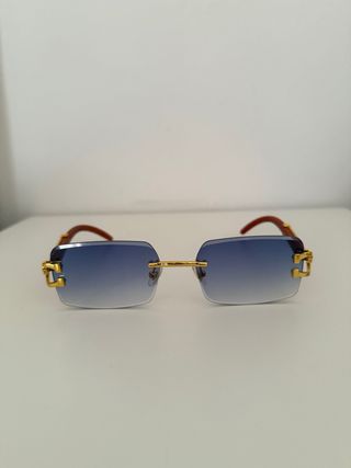 Gafas sol azules doradas