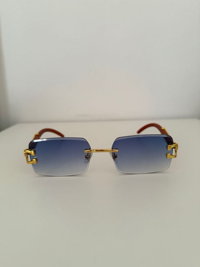 Gafas sol azules doradas