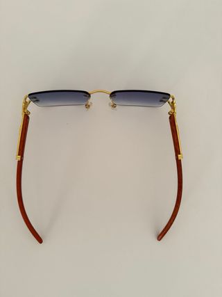 Gafas sol azules doradas