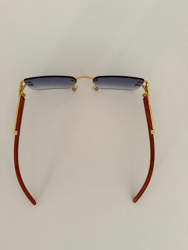 Gafas sol azules doradas