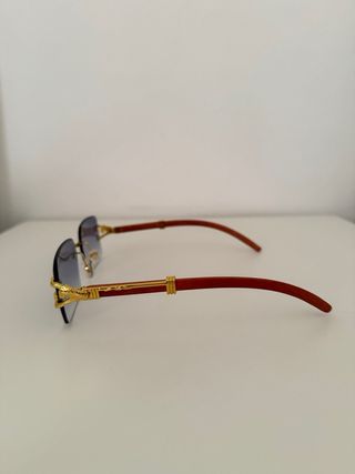 Gafas sol azules doradas