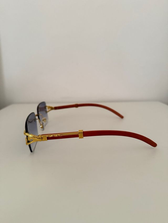 Gafas sol azules doradas