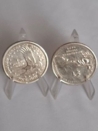  Monedas $1: Sacagawea & Tratado Wampanoag.
