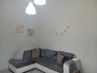 Divano letto angolare grigio e bianco