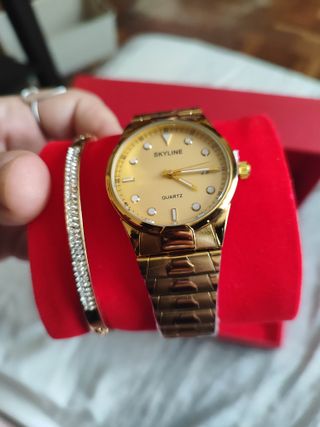 Reloj y pulsera Skyline dorados