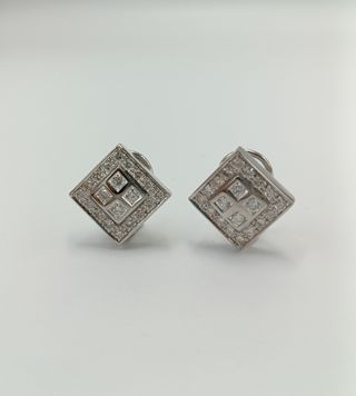 Pendientes de oro blanco de 18kt y brillantes.
