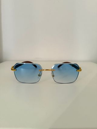 Gafas sol azules doradas