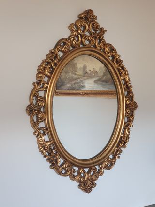 Espejo ovalado dorado, madera tallada
1m x 74 cm
