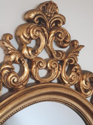 Espejo ovalado dorado, madera tallada
1m x 74 cm
