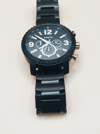 Reloj Fossil negro y dorado