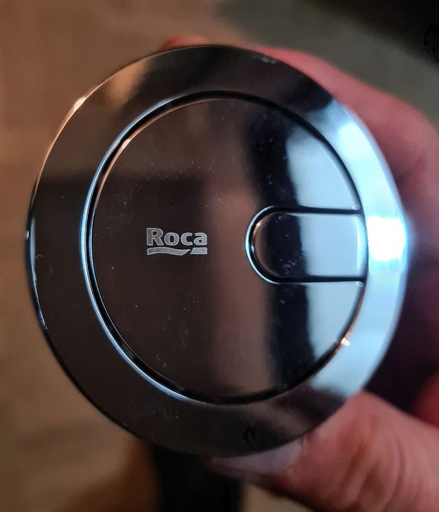 Pulsador para descarga de inodoro, marca Roca