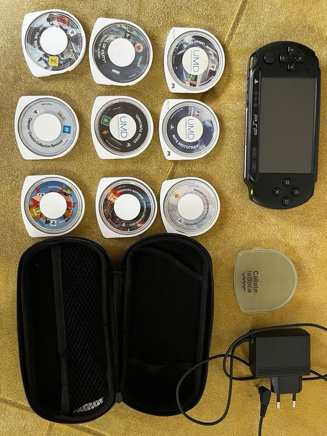 PSP nera+custodia + 9 giochi+caricabatterie 