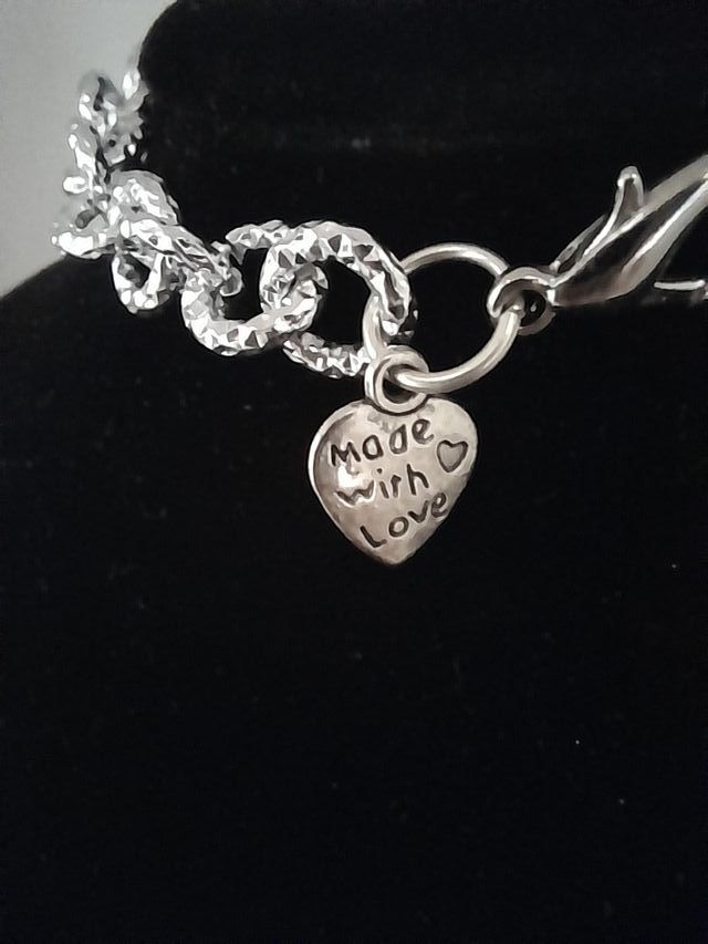 Bracciale metallo color argento ciondolo G