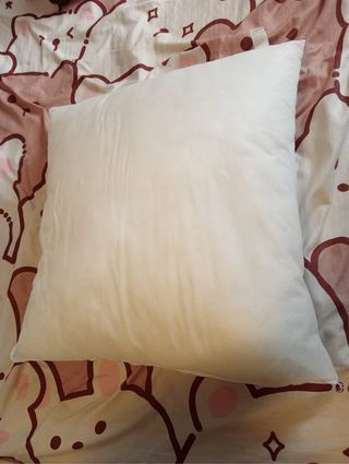 Almohada blanca de algodón