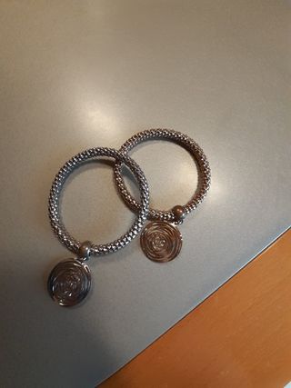 Bracciali oro e argento con ciondolo