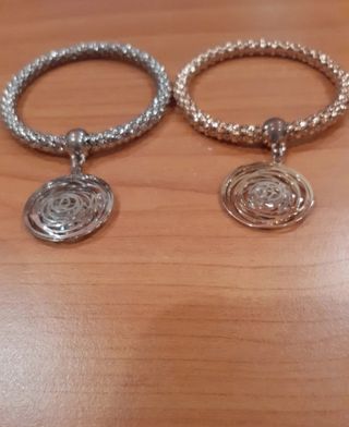 Bracciali oro e argento con ciondolo