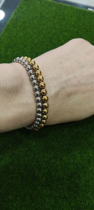 Pulseras bolas acero: oro y plata