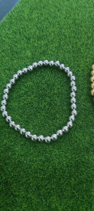 Pulseras bolas acero: oro y plata