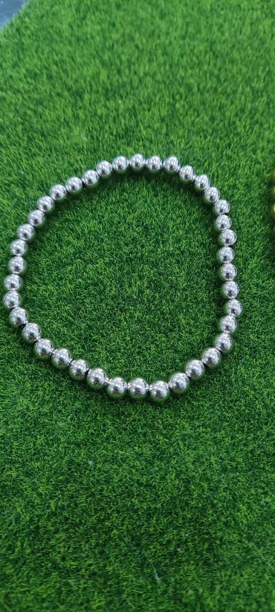 Pulseras bolas acero: oro y plata
