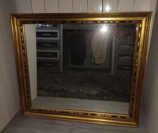 Espejo dorado con marco