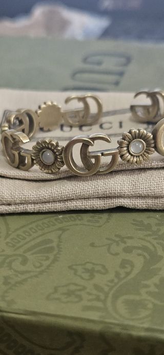 Pulsera Gucci dorada con turquesa