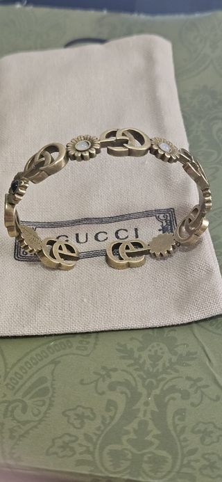 Pulsera Gucci dorada con turquesa