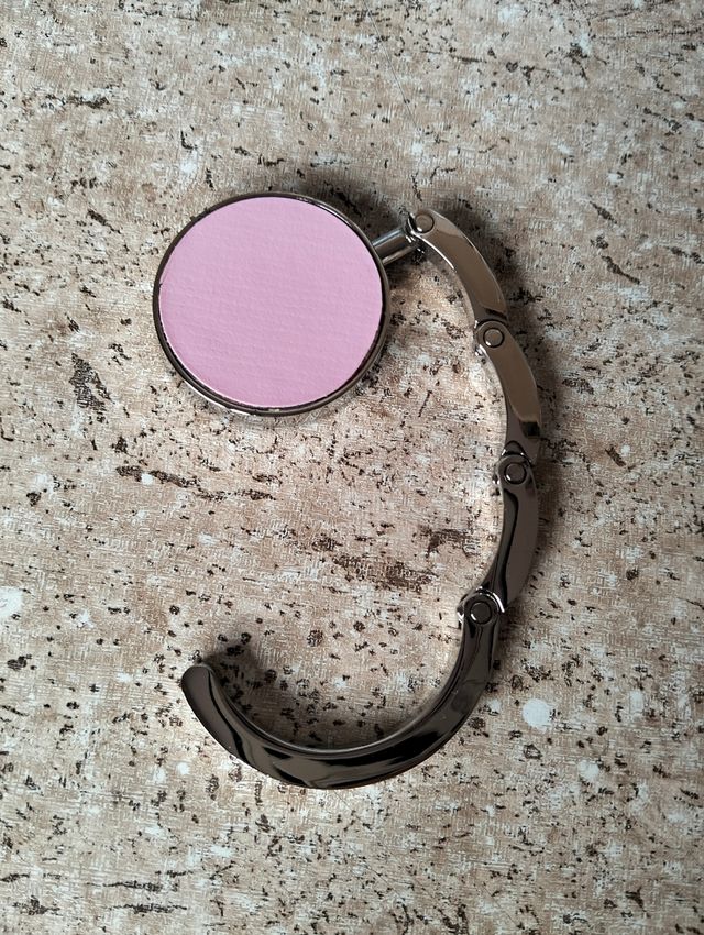 Cuelgabolsos plegable rosa