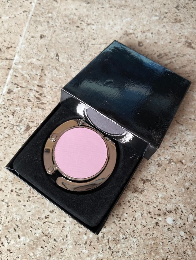 Cuelgabolsos plegable rosa