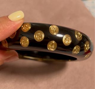 Pulsera Carolina Herrera - Negra y dorada