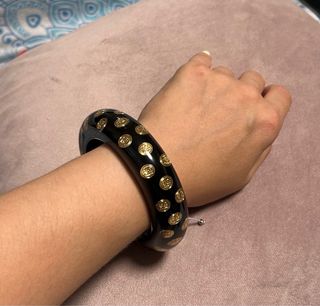 Pulsera Carolina Herrera - Negra y dorada