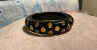 Pulsera Carolina Herrera - Negra y dorada