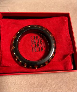 Pulsera Carolina Herrera - Negra y dorada