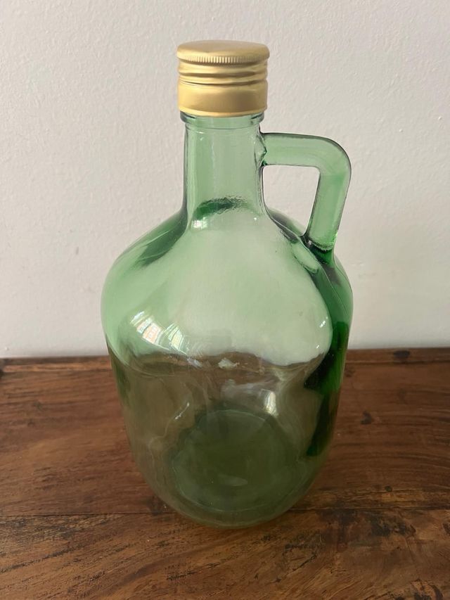 Garrafa vidrio con asa