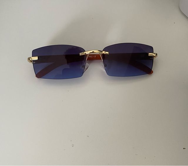 Gafas de sol azules doradas